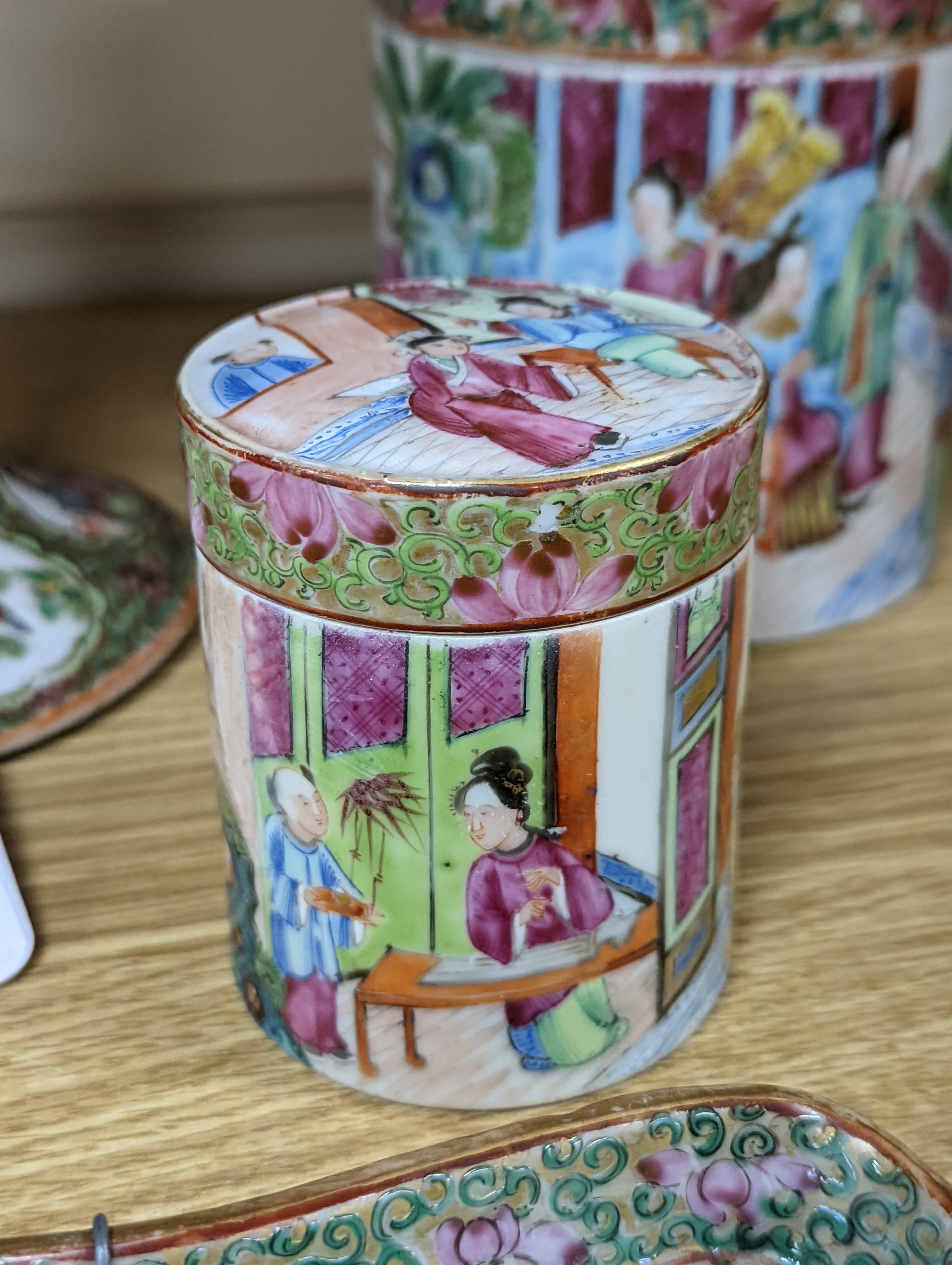 A Chinese Canton famille rose nest of boxes and covers, a similar candlestick and a tray 23cm